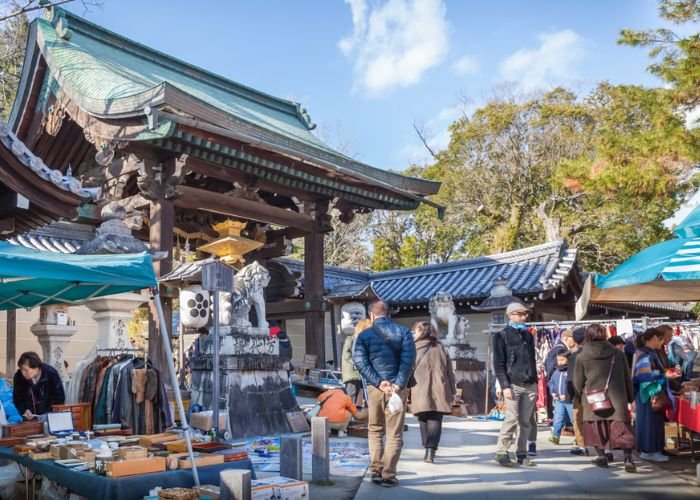 People shopping for antiques at Kyoto's Tenjin-san Flea Market