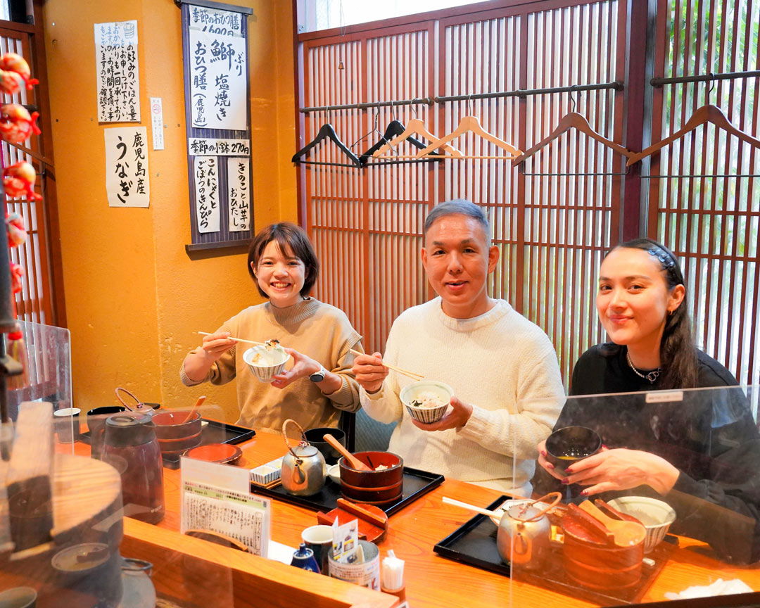 Three people enjoying a Japanese breakfast at Gohanzen Tambo