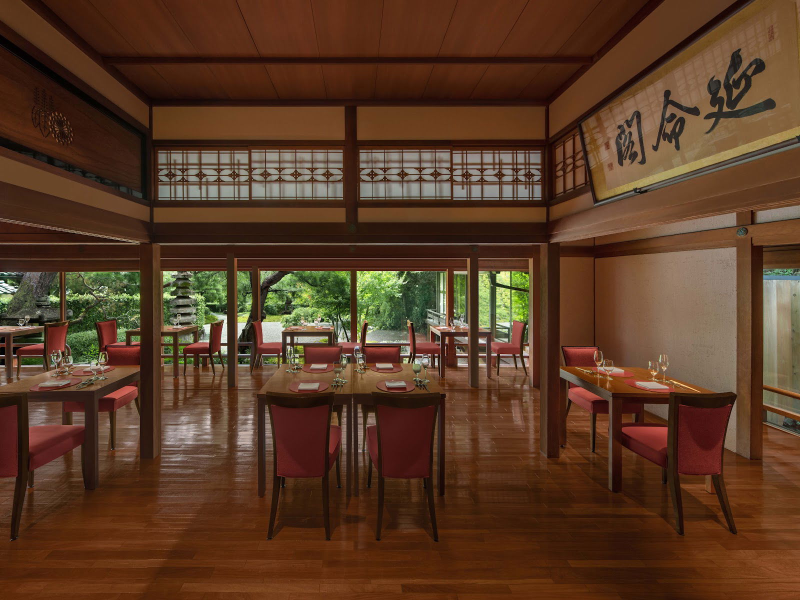 The spacious dining area of Kyo-Suiran, overlooking a Japanese garden.