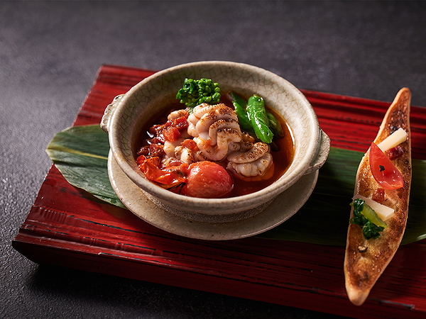Gourmet dish with seafood and vegetables in a rustic bowl