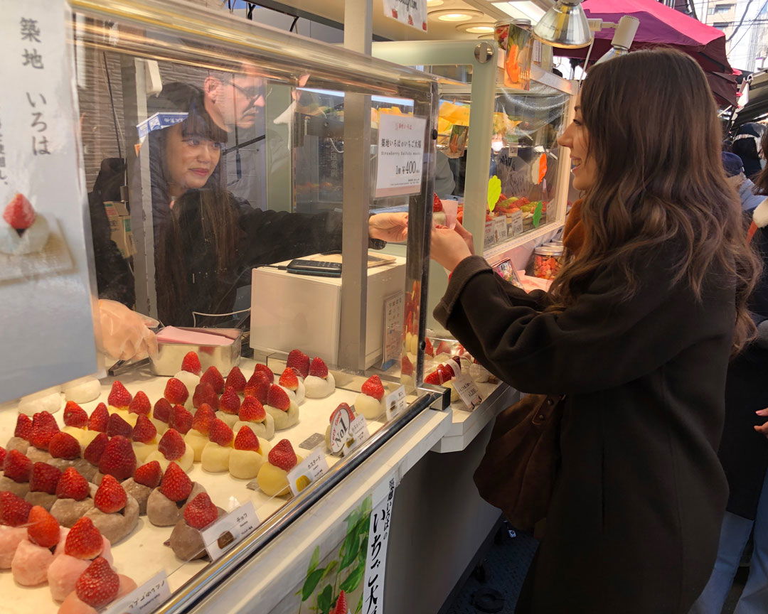 A vendor serving Shizuka at Tsukiji Market.