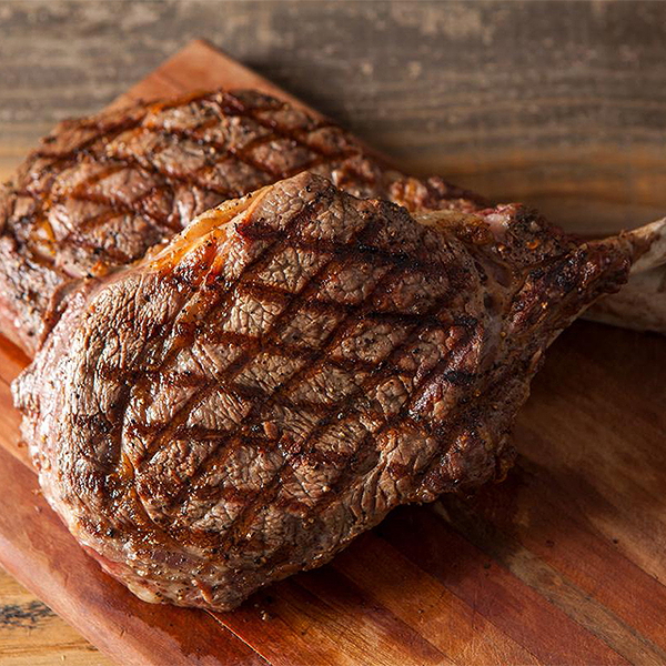 Juicy grilled steak on cutting board