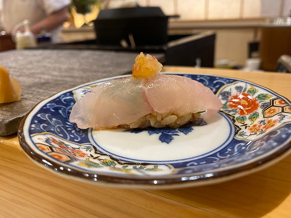 Exquisite sushi on decorative plate at Japanese restaurant
