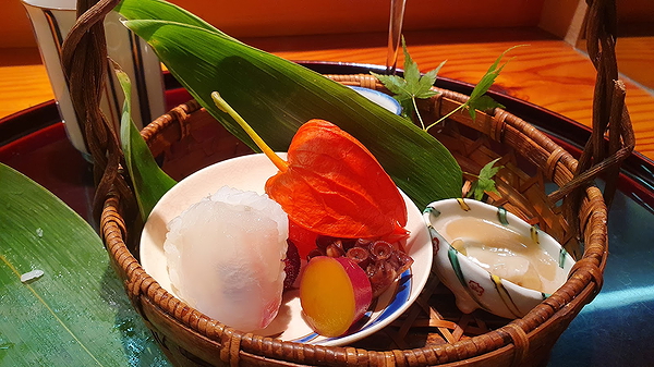 Artful sushi platter with fresh octopus and garnishes