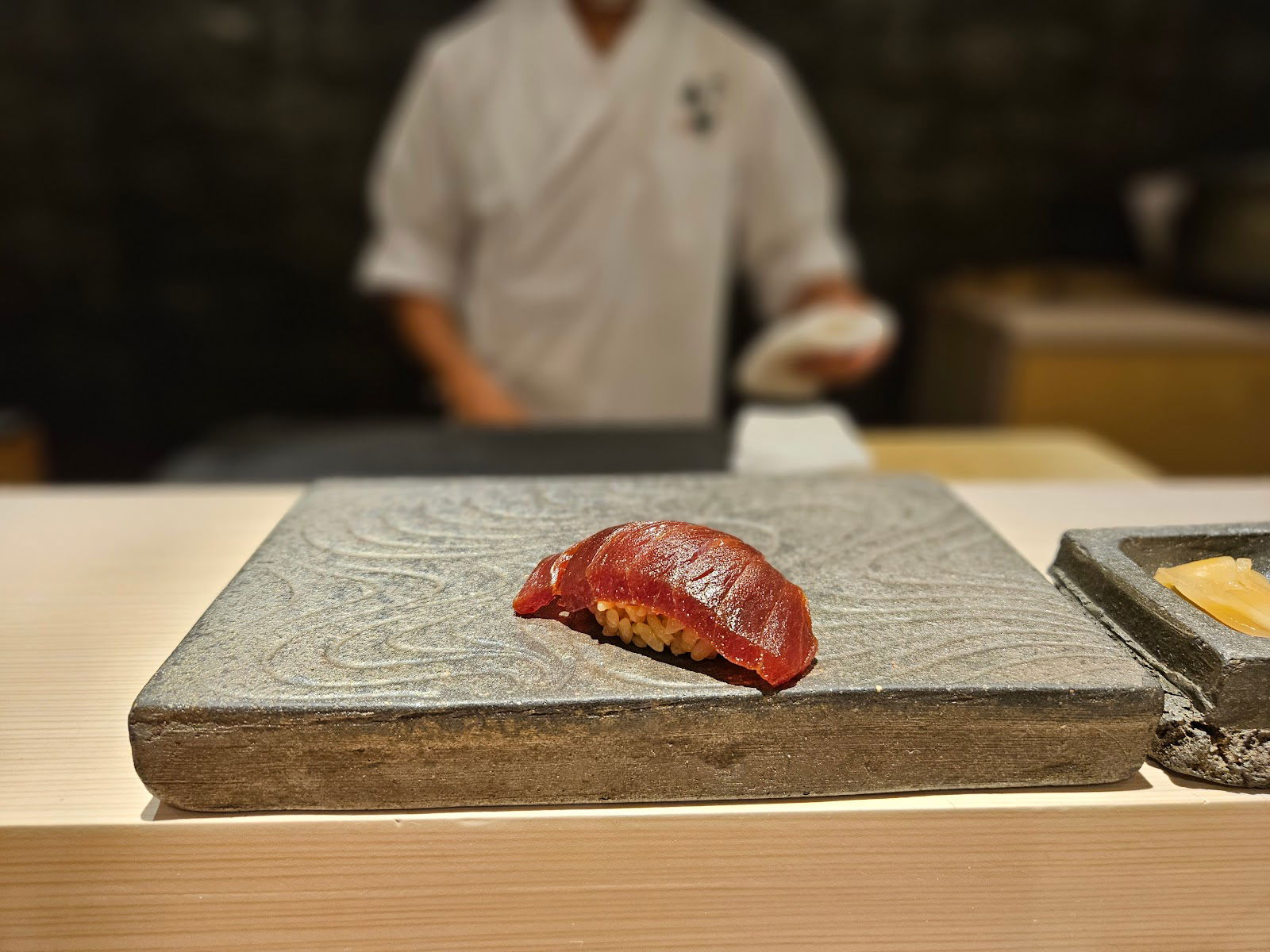 Sit back and enjoy sushi at Sushi Akazu Shinsaibashi.