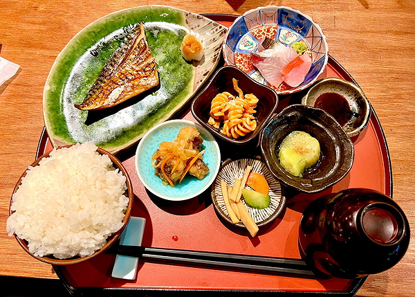 Authentic Japanese breakfast with grilled fish and assorted side dishes