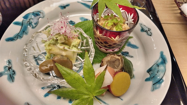 Elegant restaurant dish with diverse ingredients and artistic presentation