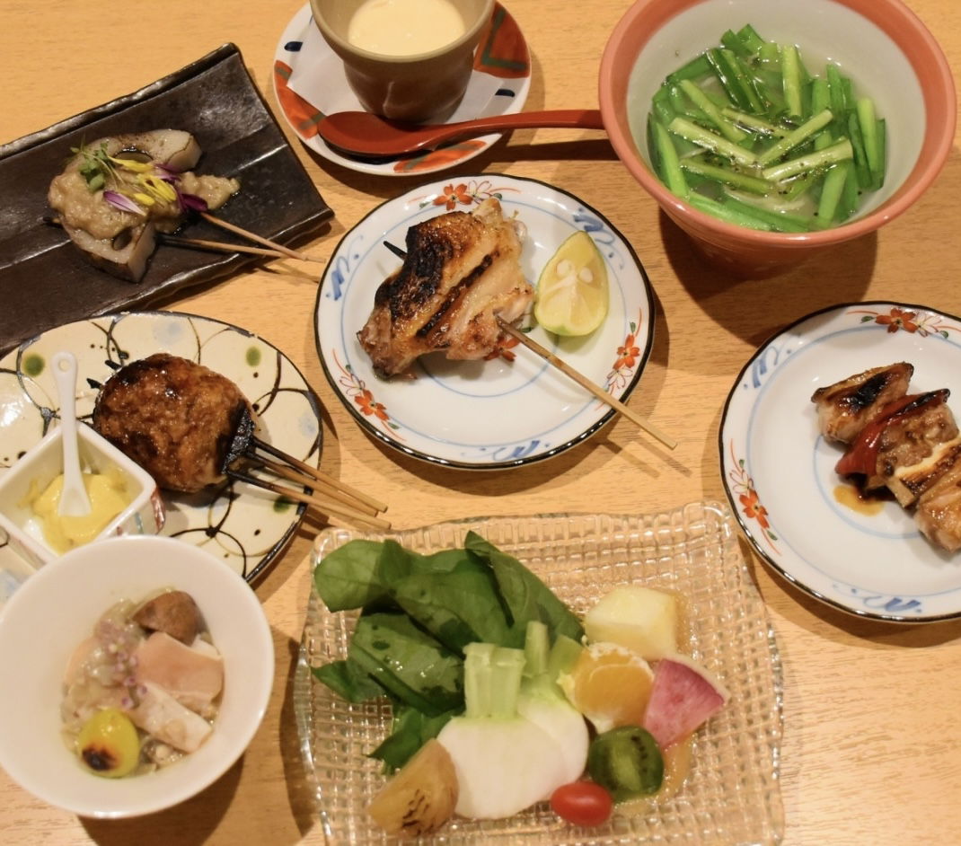 A table filled with yakitori delights at Yakitori Ginza I.