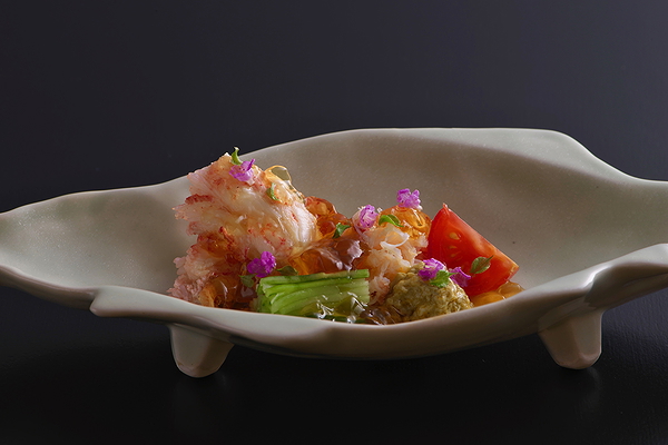 Exquisite gourmet dish on elegant ceramic plate in fine dining restaurant