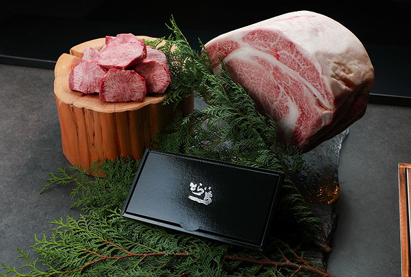 Premium Wagyu beef display with natural garnishes