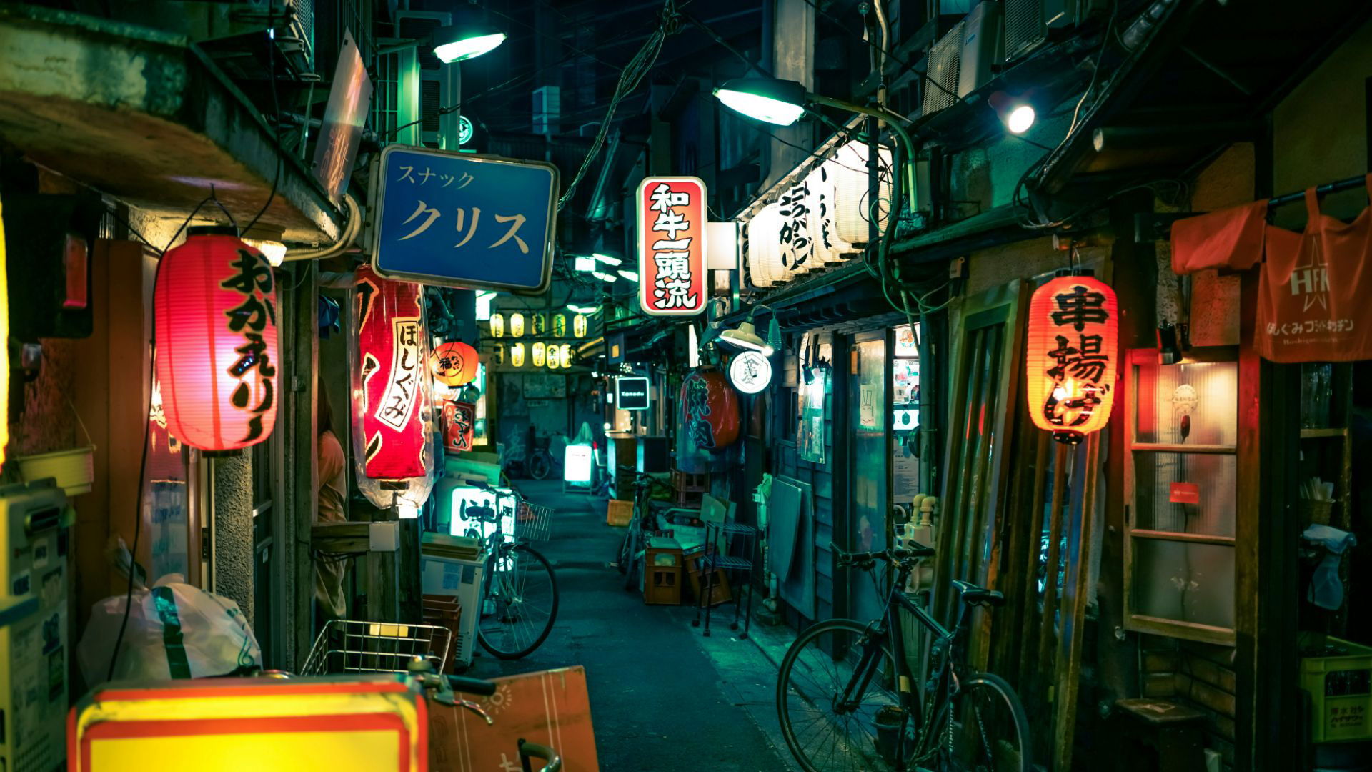 Neon-lit alleyway in Tokyo's bustling nightlife district