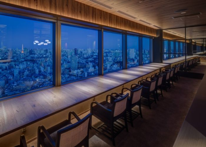 The view from KINTAN Ebisu, overlooking Tokyo with the Tokyo Tower in the distance.