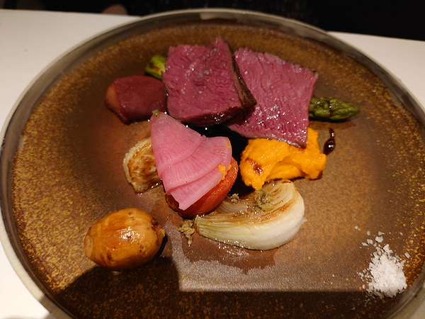 Gourmet plated steak with vegetables at a fine dining restaurant