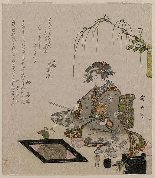 Woman performing Japanese tea ceremony