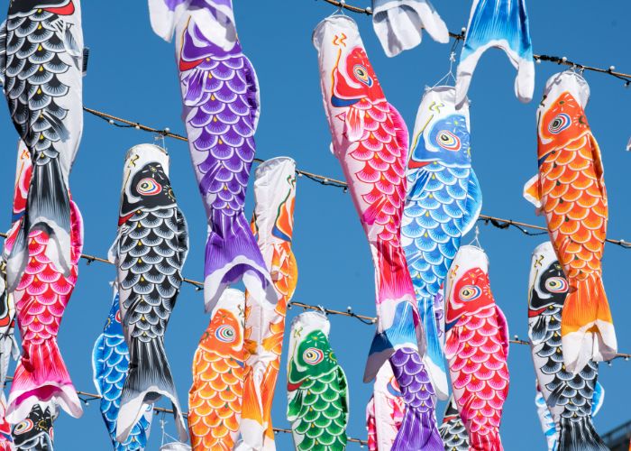 Carp streamers against a blue sky on Children's Day.