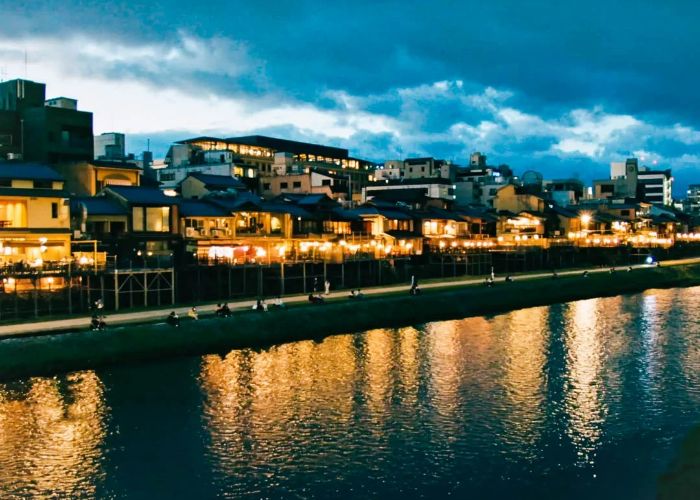 Looking out over the river at night in Kyoto.