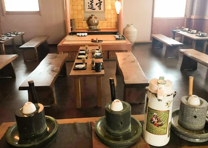 All the utensils required for creating matcha tea, lined up at a matcha green tea tour in Kyoto.