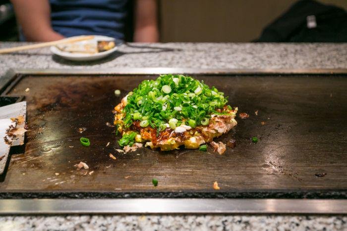 Cooking osaka style okonomiyaki
