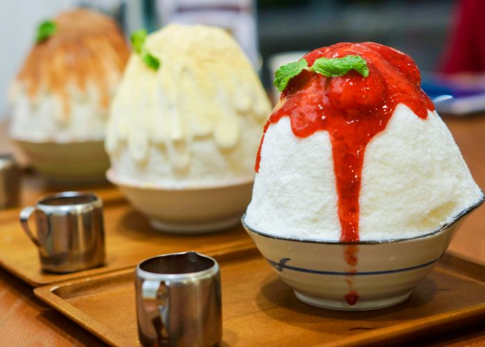 A selection of kakigori shaved ice with different toppings.