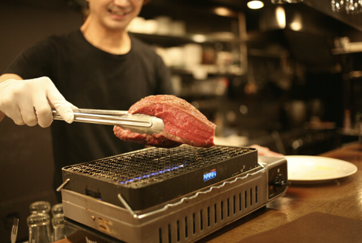 A juicy cut of beef about to be added to the grill at Niku no Himaraya to Nomuno.