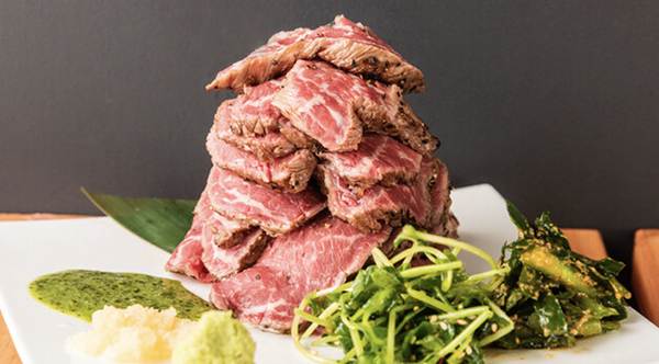 Gourmet steak dish with garnish at a fine dining restaurant