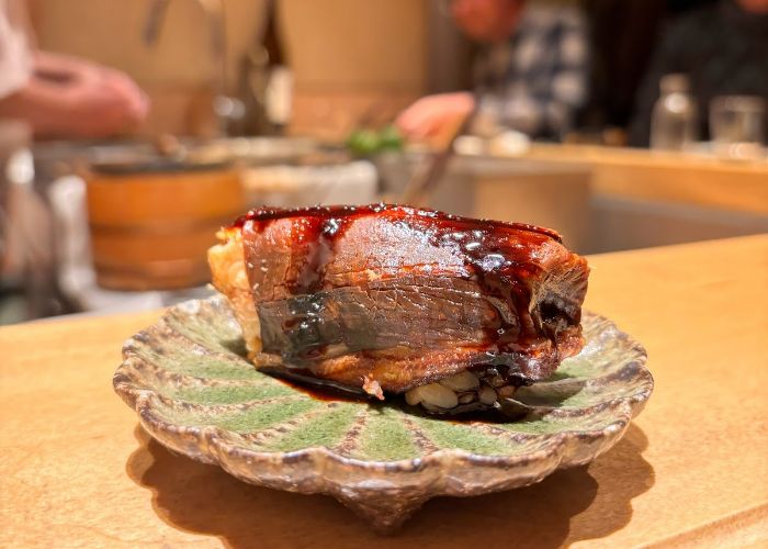 Carefully crafted Michelin star sushi on a delicate serving dish.