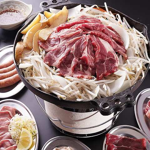 Sizzling lamb dish with vegetables at a stylish restaurant