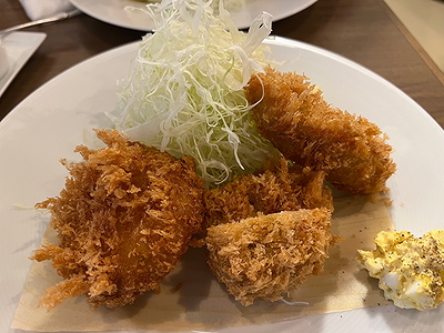 Crispy fried seafood platter with shredded cabbage garnish