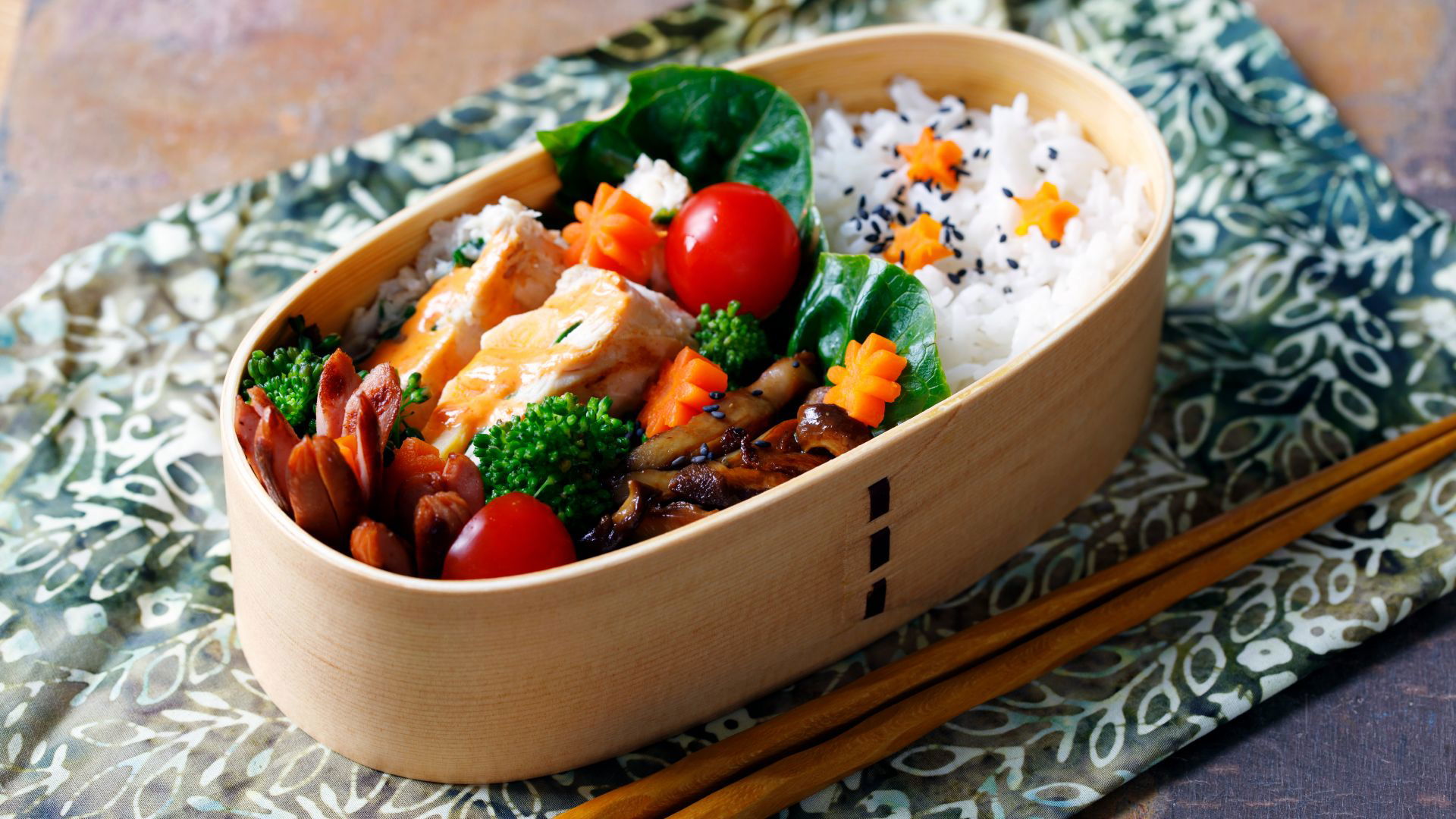 Beautifully arranged bento box with rice and vegetables