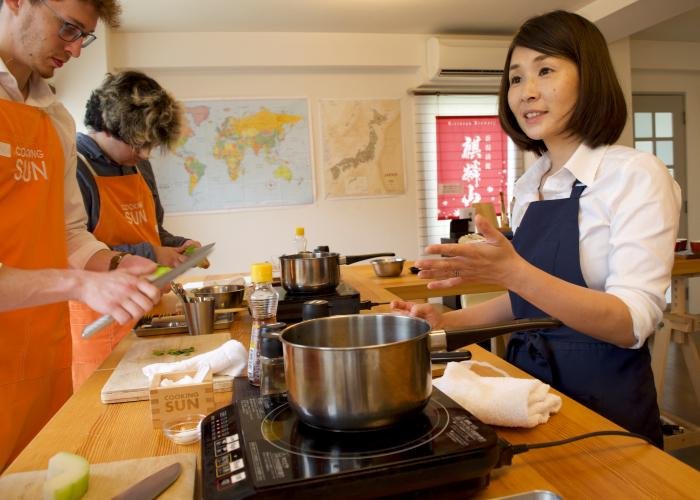 The host explains the next steps at a wagyu and kaiseki cooking class in Tokyo.