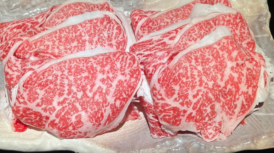 Premium marbled Wagyu beef slices on display