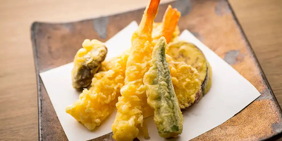 Assorted tempura on a plate with shrimp and vegetables