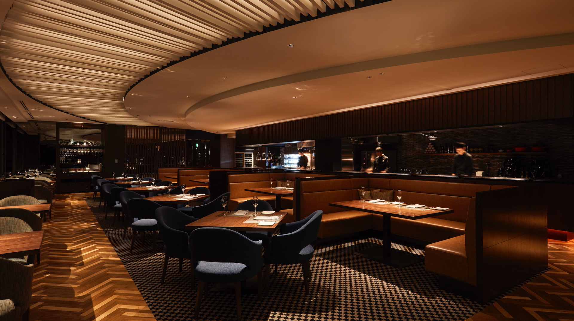 The spacious, warmly lit dining space of The Grill on 30th.