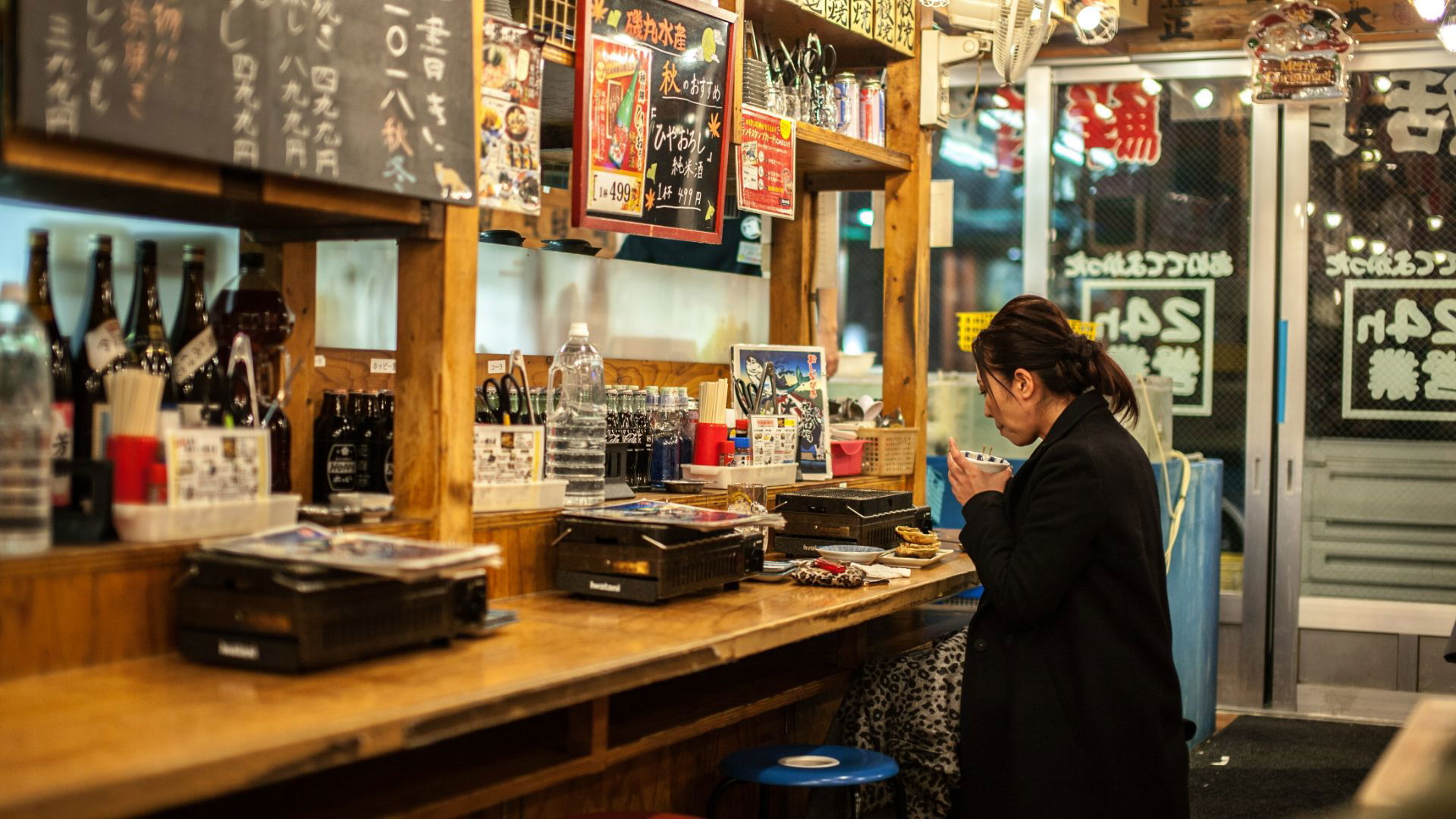 Cozy Japanese Izakaya with Customer Enjoying Meal