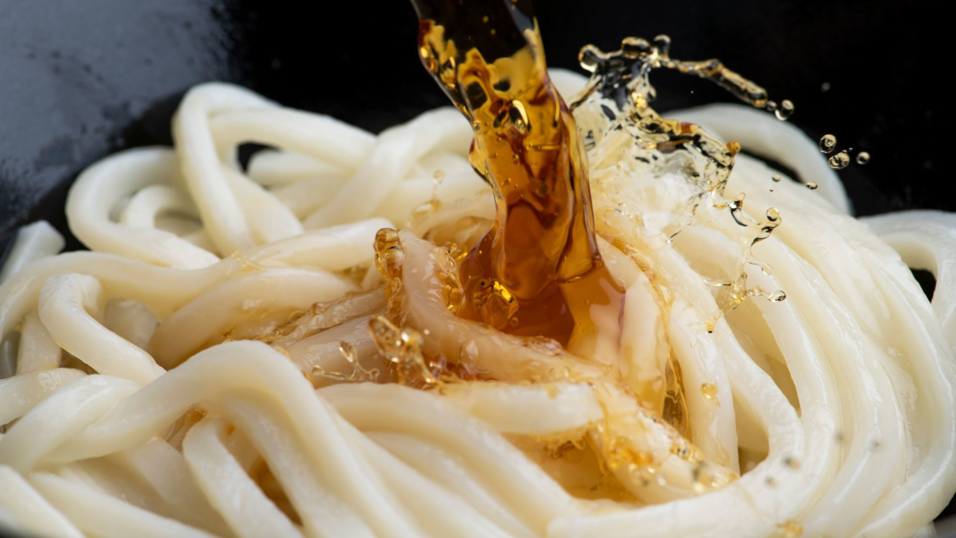 Udon noodles topped with savory soy sauce splash