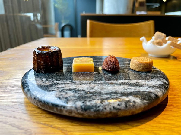 Elegant dessert assortment on marble plate in chic restaurant setting