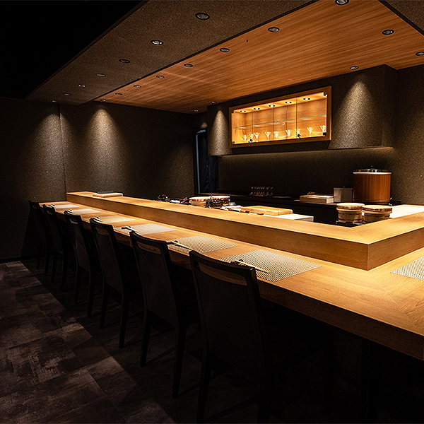Elegant modern restaurant interior with wooden counter and ambient lighting