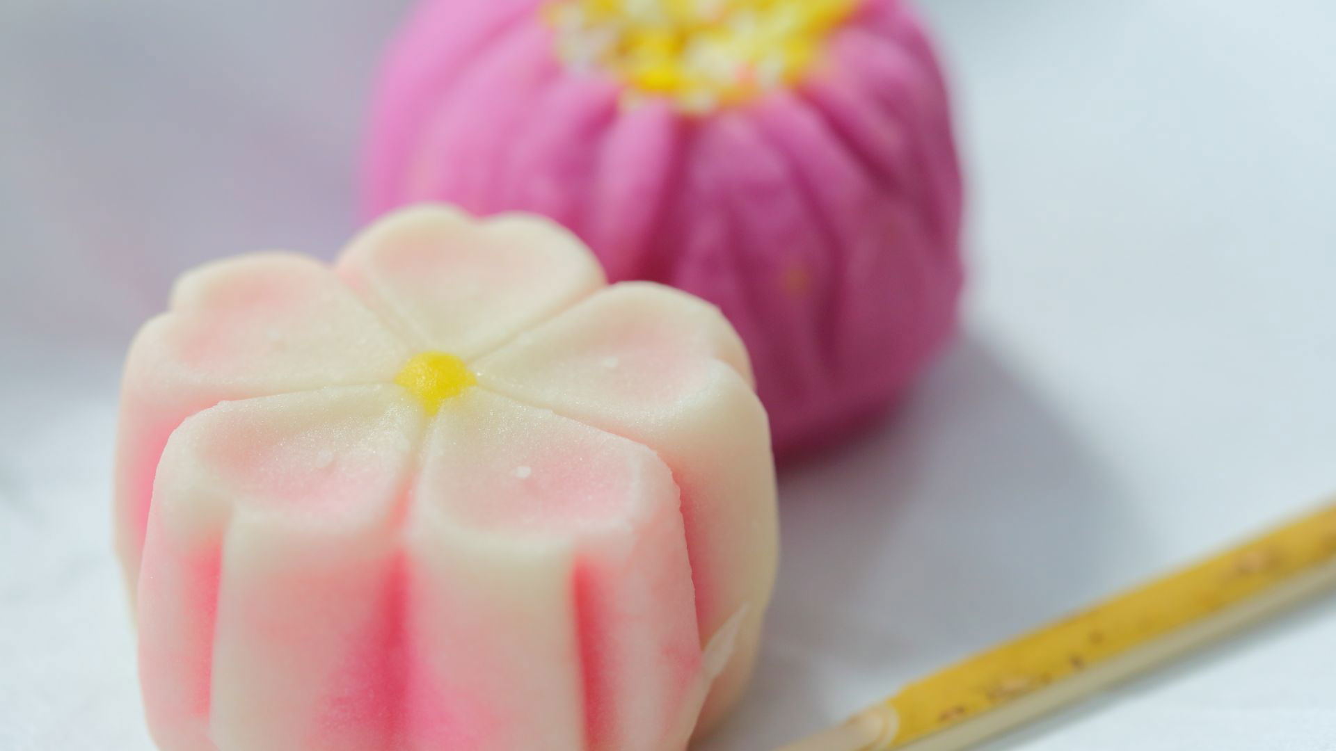 Colorful Japanese wagashi sweets on a white background