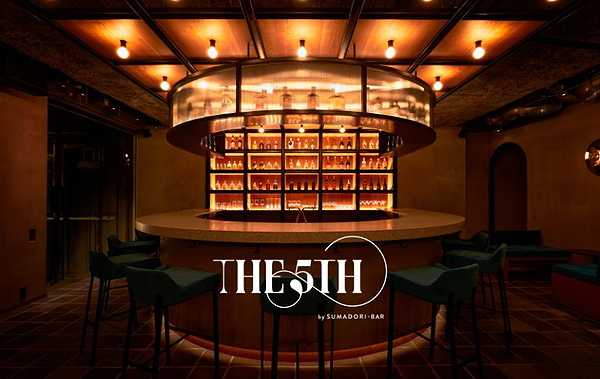 Stylish dimly lit bar interior with round counter and backlit shelves