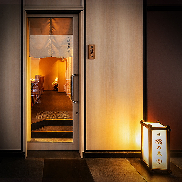 Cozy restaurant entrance with ambient lighting and inviting decor