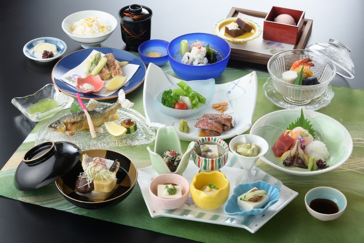 Elegant Japanese course menu with assorted dishes on a table