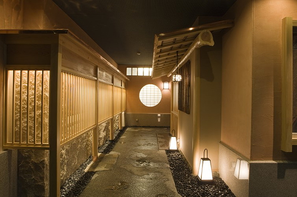 Elegant Japanese restaurant entrance with warm lighting and traditional decor