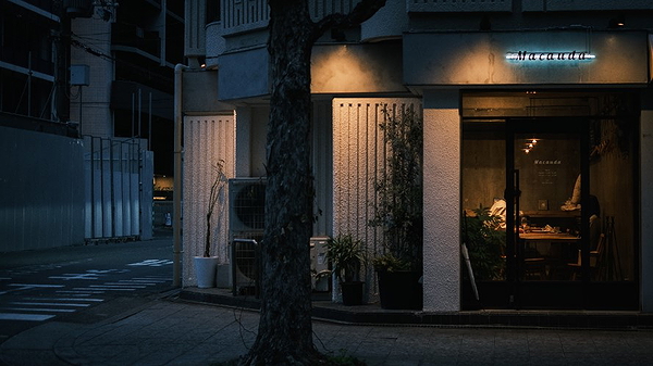 Cozy restaurant exterior at night with warm lighting and inviting ambiance
