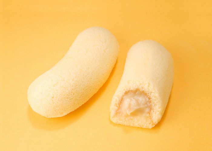 Two Tokyo Banana cakes, with one cut in half to show the inside