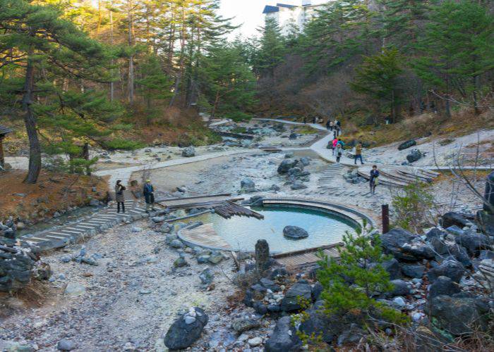 A rotenburo, an outside hot springs bath in an area of natural beauty.