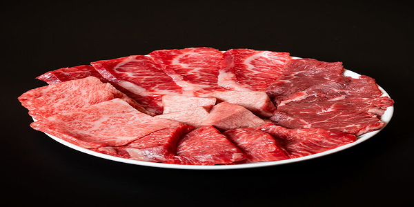 Premium raw steak cuts on a plate ready for grilling