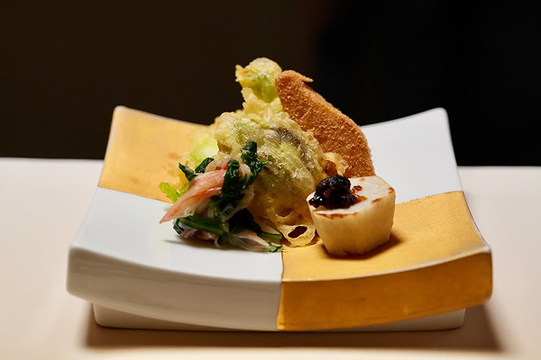 Gourmet dish with unique plating and diverse ingredients at a fine restaurant