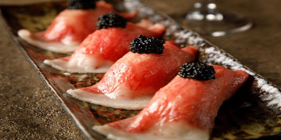 Delicious tuna sashimi topped with caviar, beautifully presented