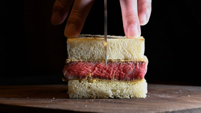 The famous wagyu beef sandwich of Ginza Yamashina, about to be sliced through.