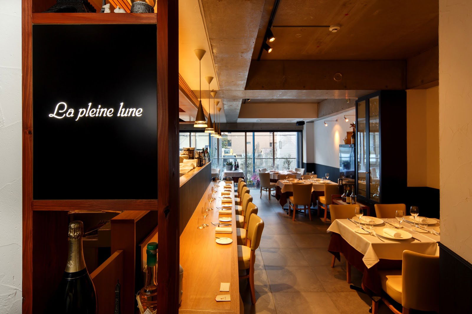Cozy restaurant interior with elegant dining setup and warm lighting
